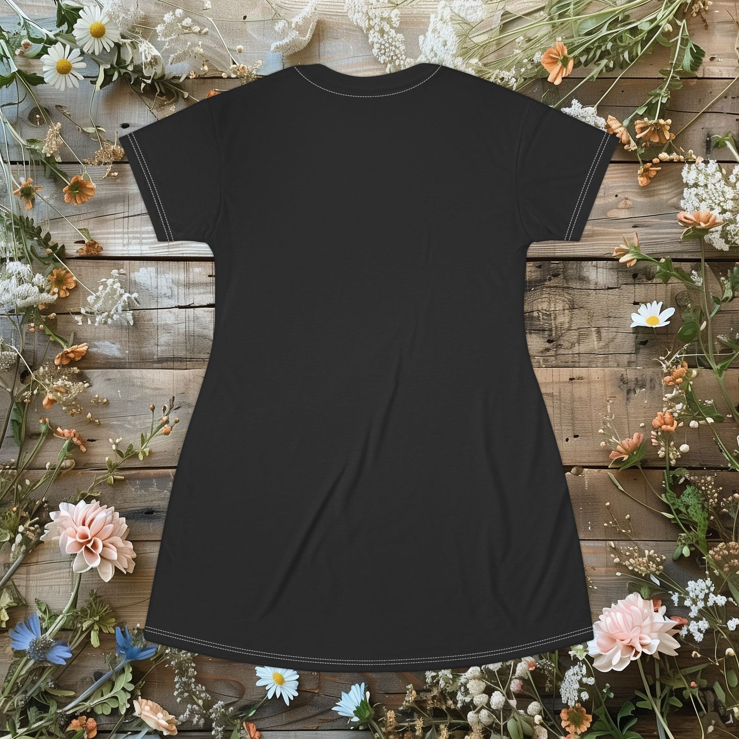 The back of a t-shirt dress in front of a wooden wall