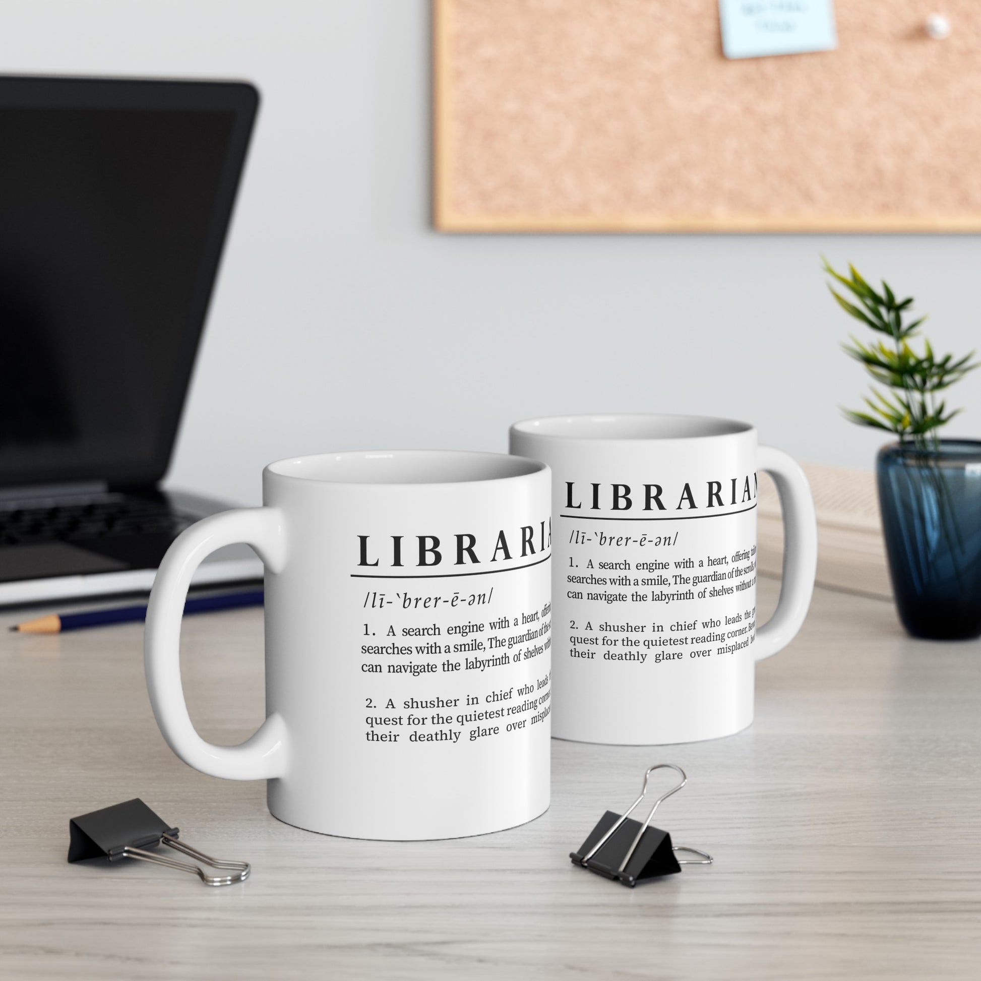 A sleek white ceramic mug presents a whimsical definition of 'Librarian', written in bold black font. The humorous text portrays a librarian as both a heartfelt search engine and a quiet corner seeker.