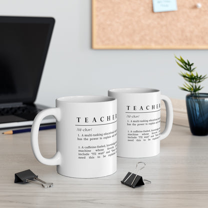 Featured is a white ceramic mug adorned with a clever and affectionate definition of 'Teacher' in black text. The description playfully outlines a teacher as a multitasking educational ninja and a caffeine-fueled knowledge sharer, adding humor to the daily realities of teaching.