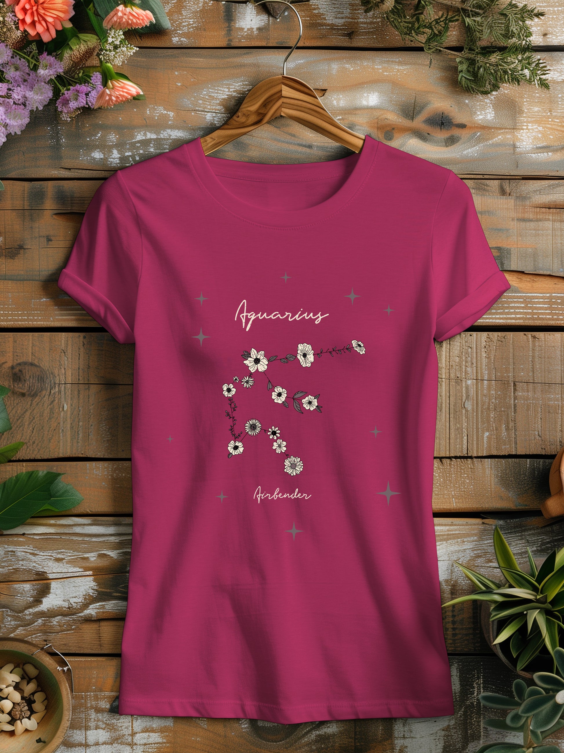 a pink t - shirt with flowers on it