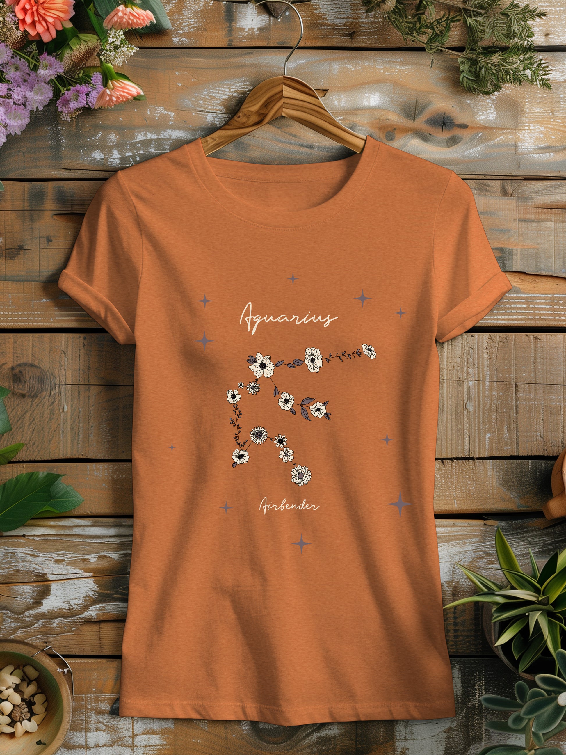 an orange t - shirt with flowers on it