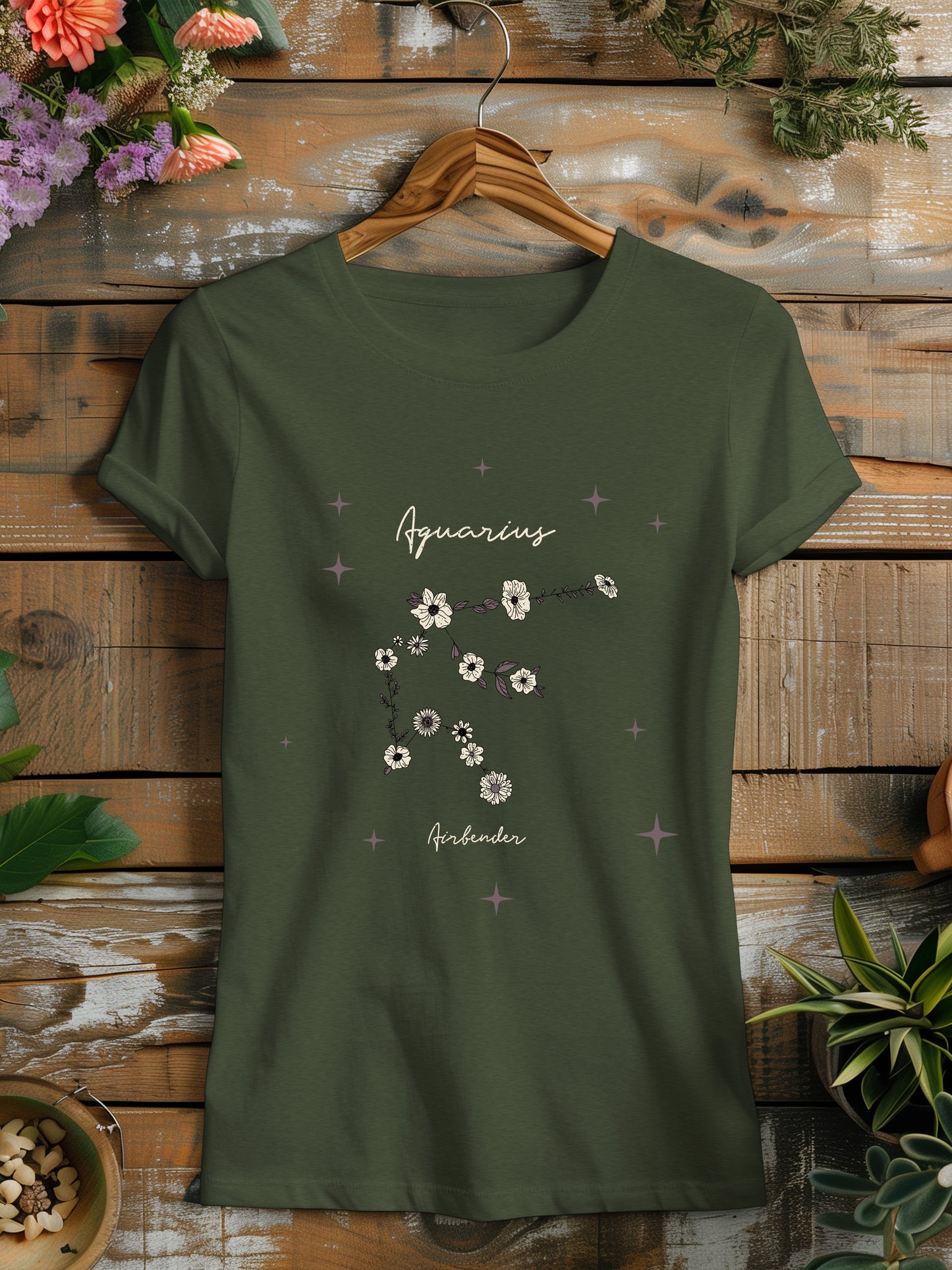 a green t - shirt with flowers on it