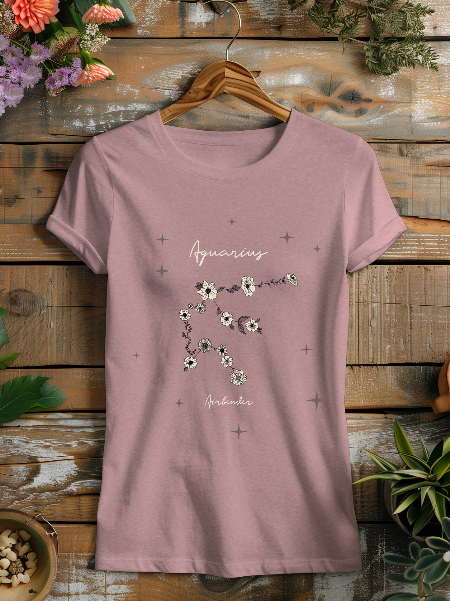 a pink t - shirt with flowers on it