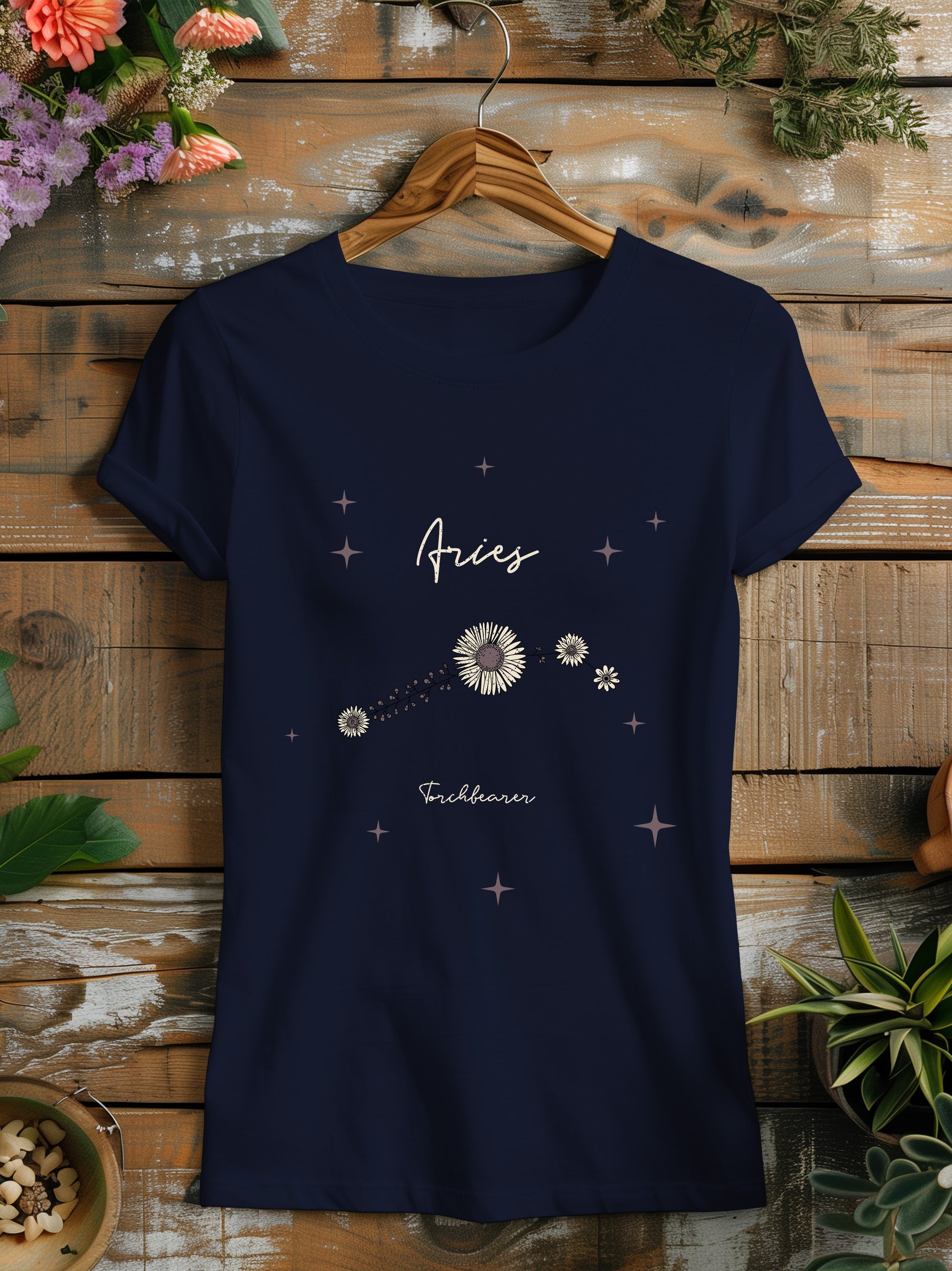 a women's t - shirt with the word aries written on it