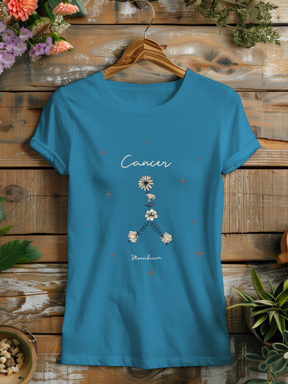 a blue t - shirt with a picture of flowers on it