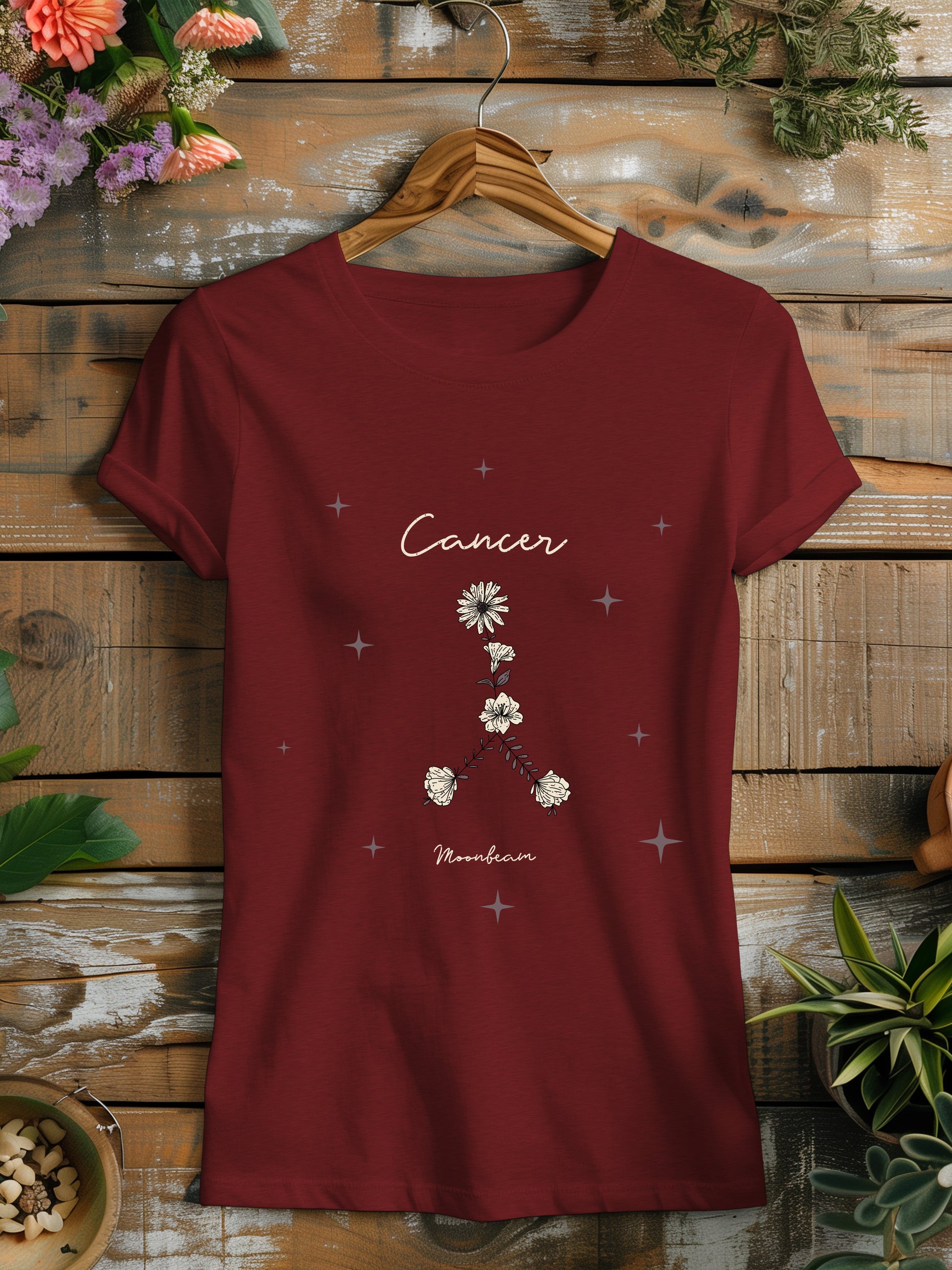 a red t - shirt with a picture of a flower on it