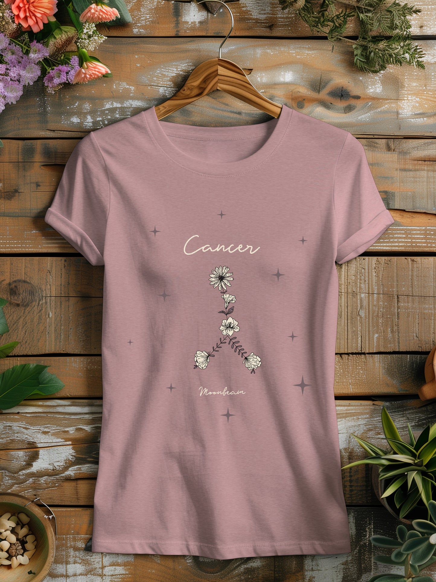 a pink t - shirt that says cancer on it