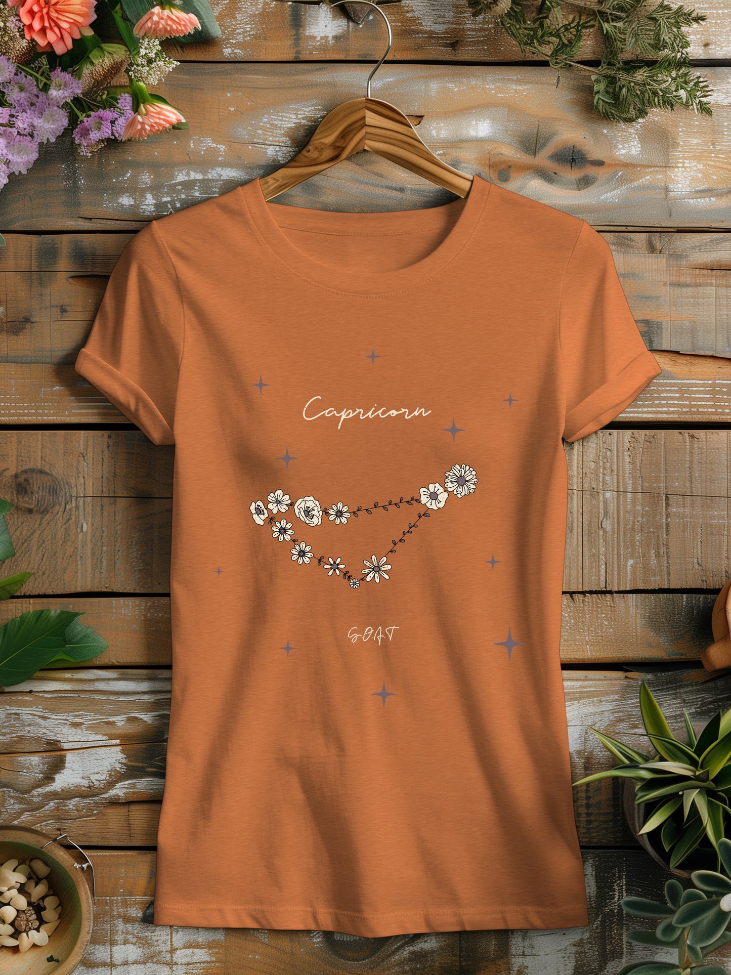 a t - shirt with a picture of a floral constellation on it