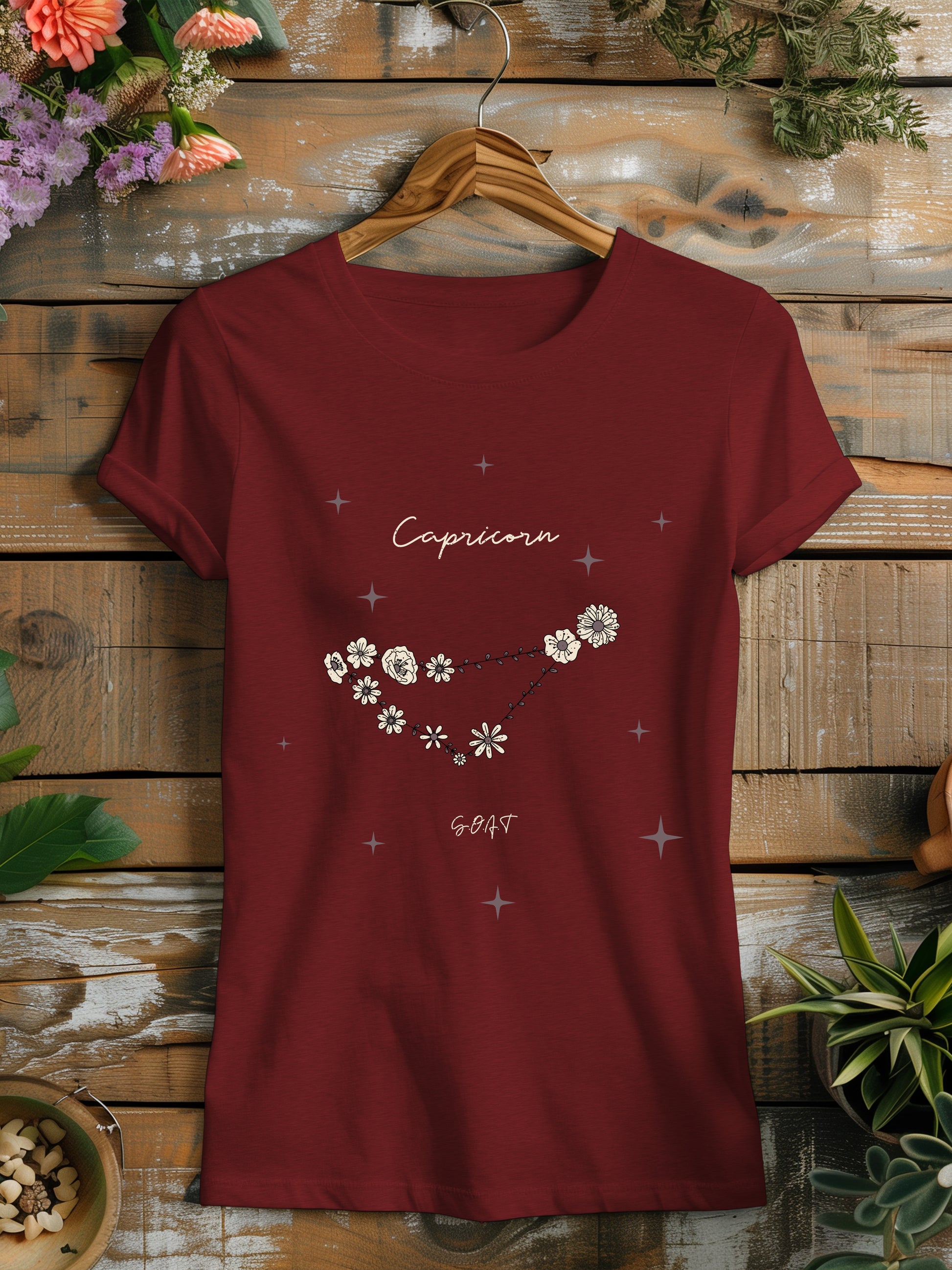 a red t - shirt with white flowers on it