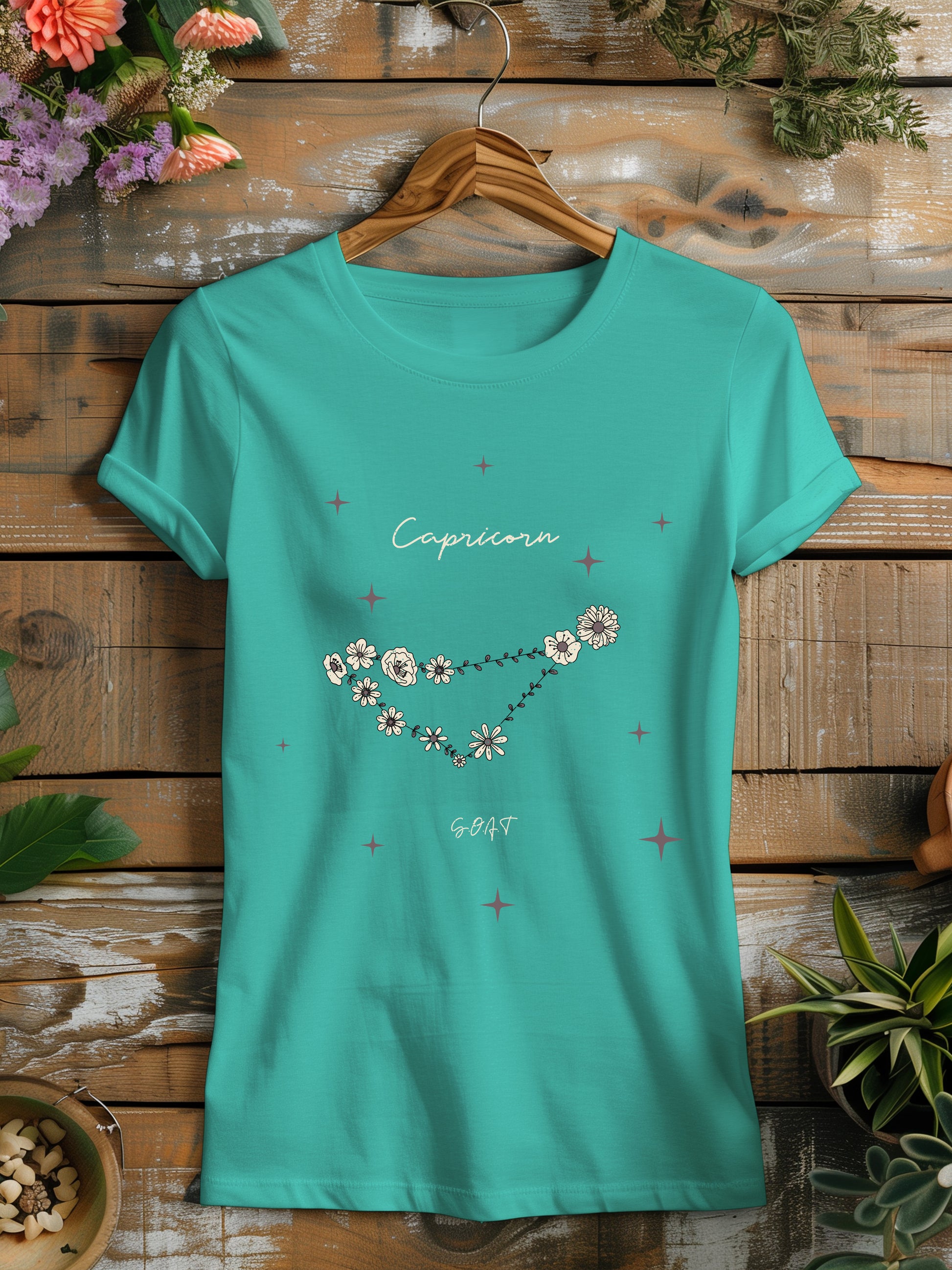 a t - shirt with a picture of the capricorn constellation on it