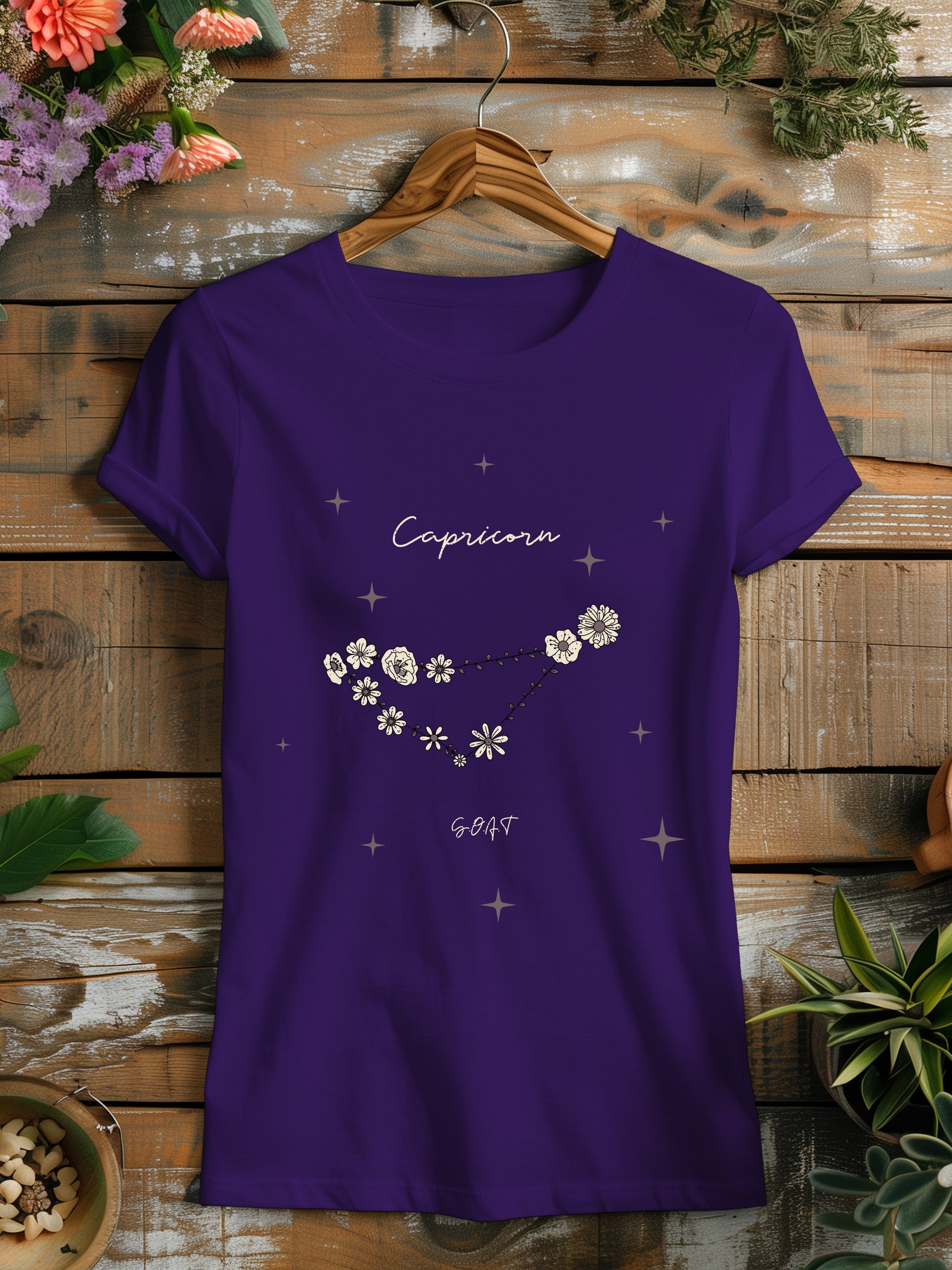 a purple t - shirt with white flowers on it