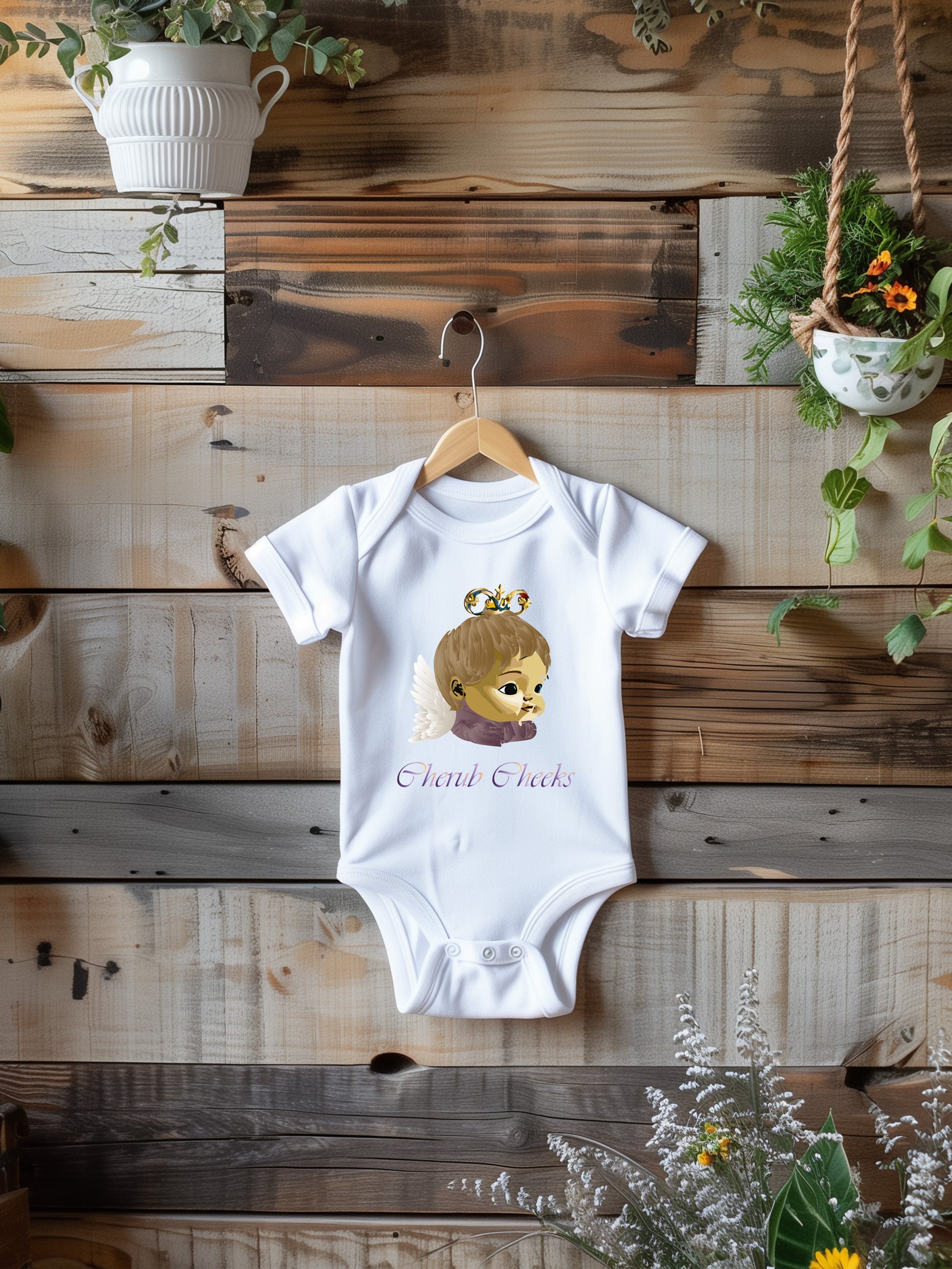 a baby bodysuit hanging on a wooden wall