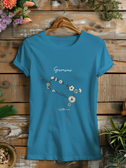 a blue t - shirt with daisies on it