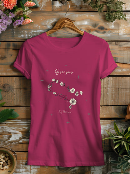 a pink t - shirt with flowers on it