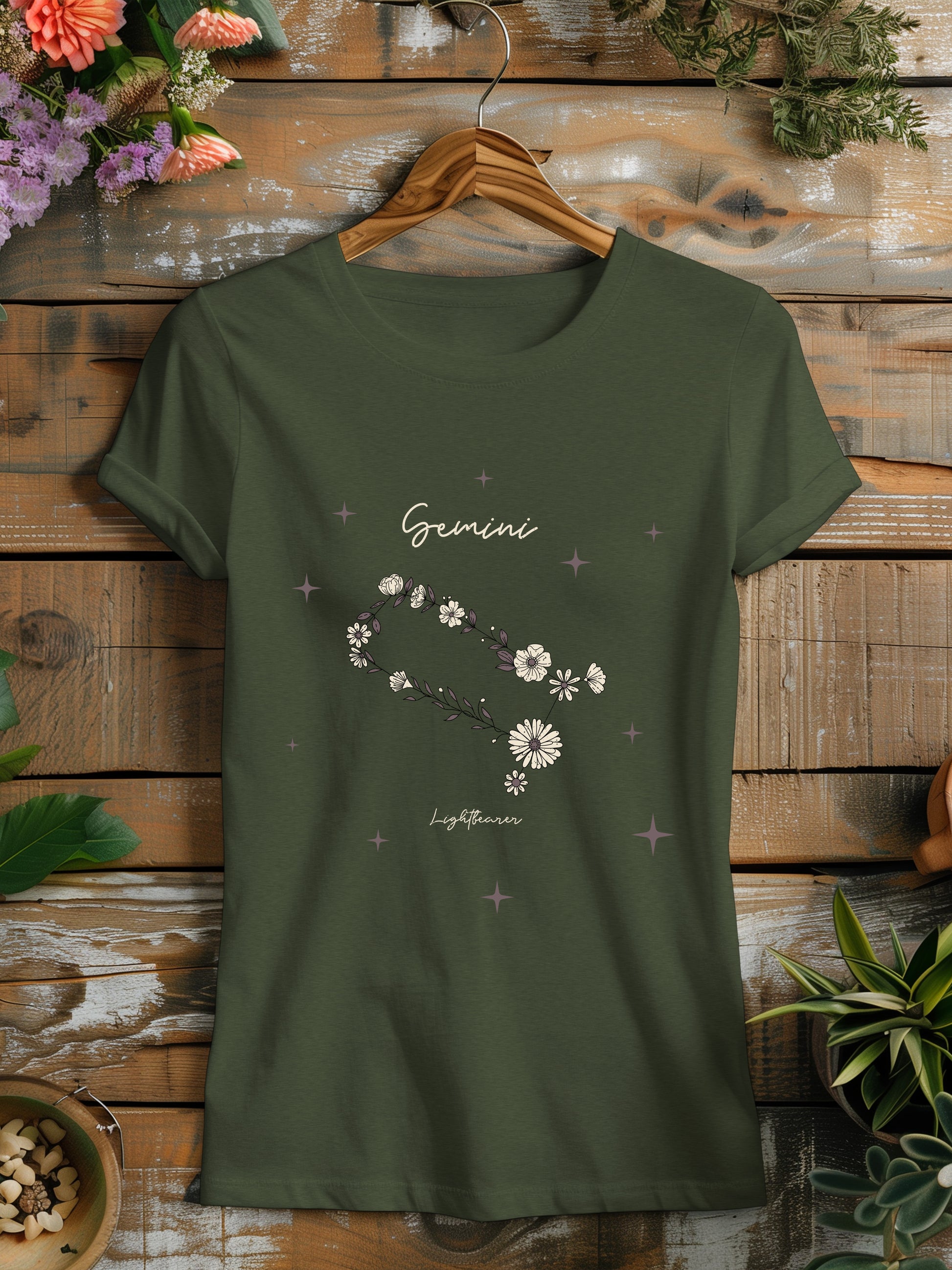 a green t - shirt with flowers on it