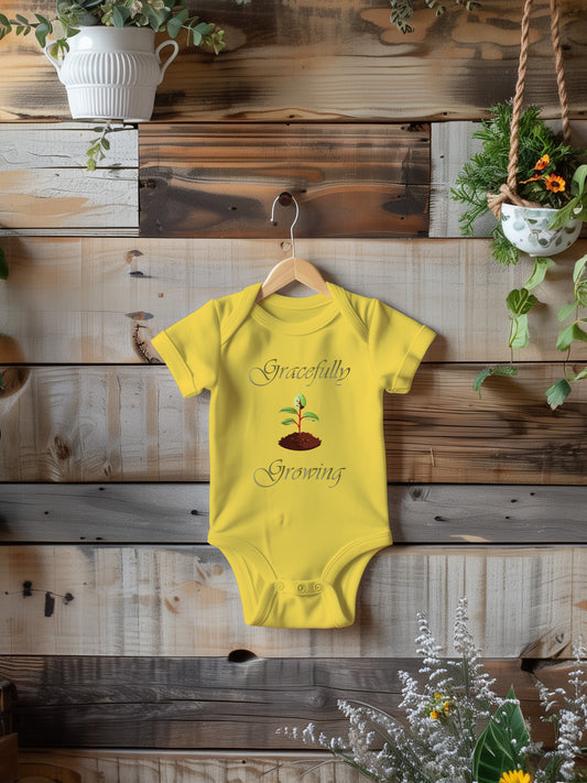 a baby bodysuit hanging on a wooden wall