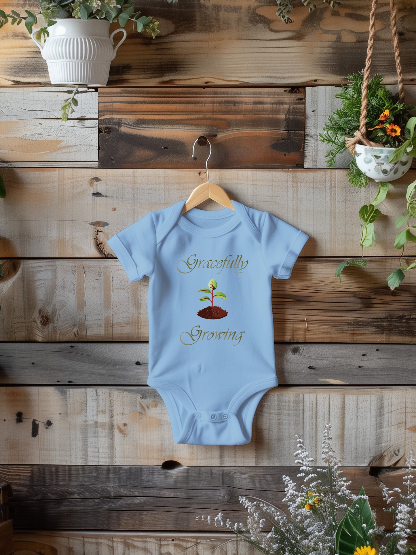 a baby bodysuit hanging on a wooden wall