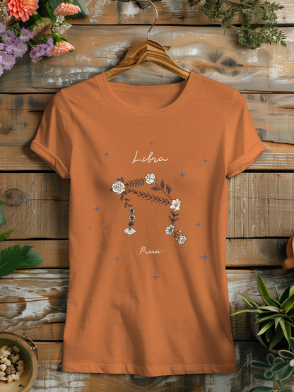 a women's t - shirt with libra constellation made of flowers on it