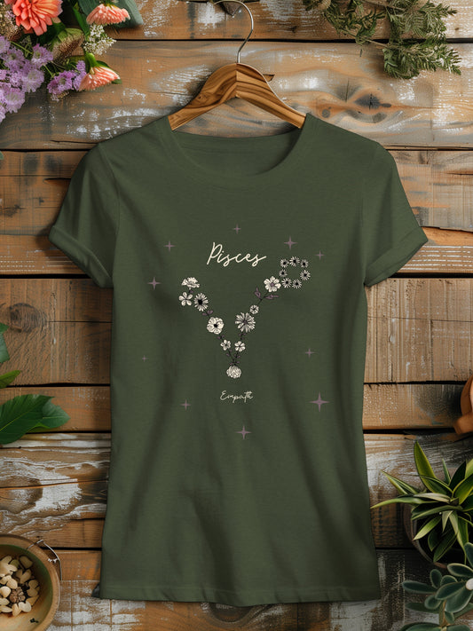 a green t - shirt with flowers on it