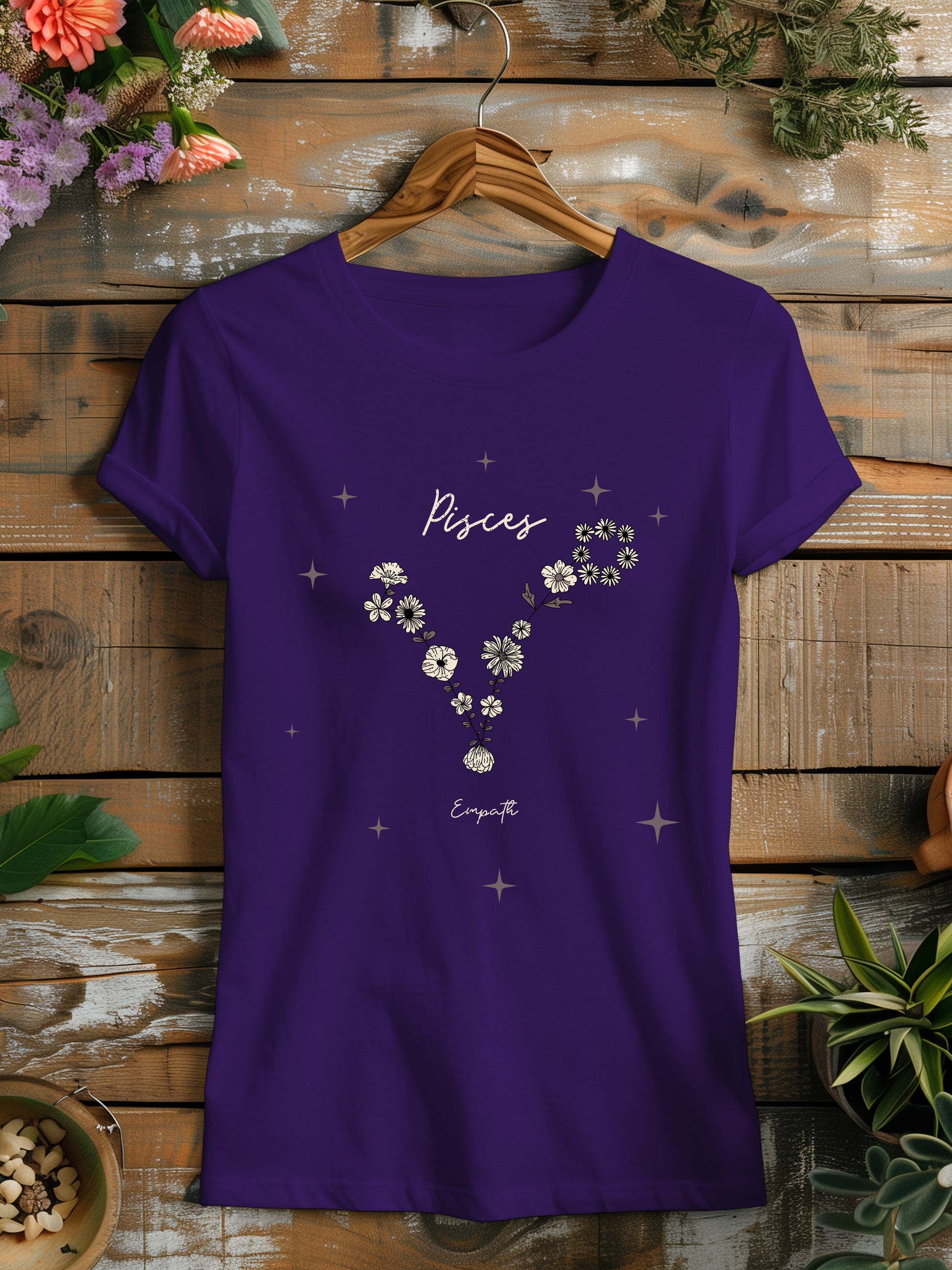 a purple t - shirt with flowers on it