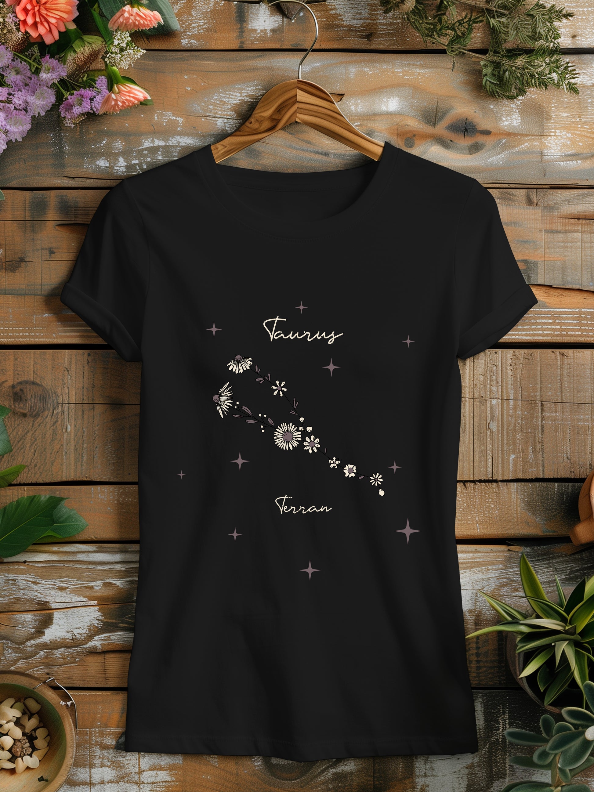 a black t - shirt with a picture of a flower on it