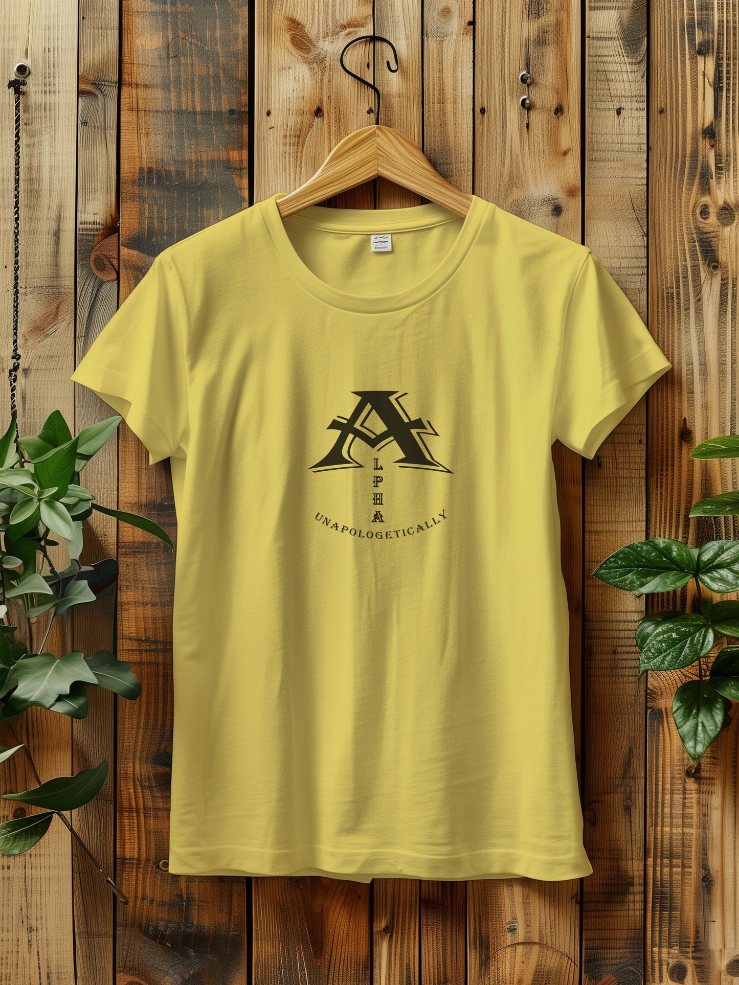 t-shirt with a bold black graphic of stylized letters with the word Alpha displayed vertically and the word UNAPOLOGETICALLY below.