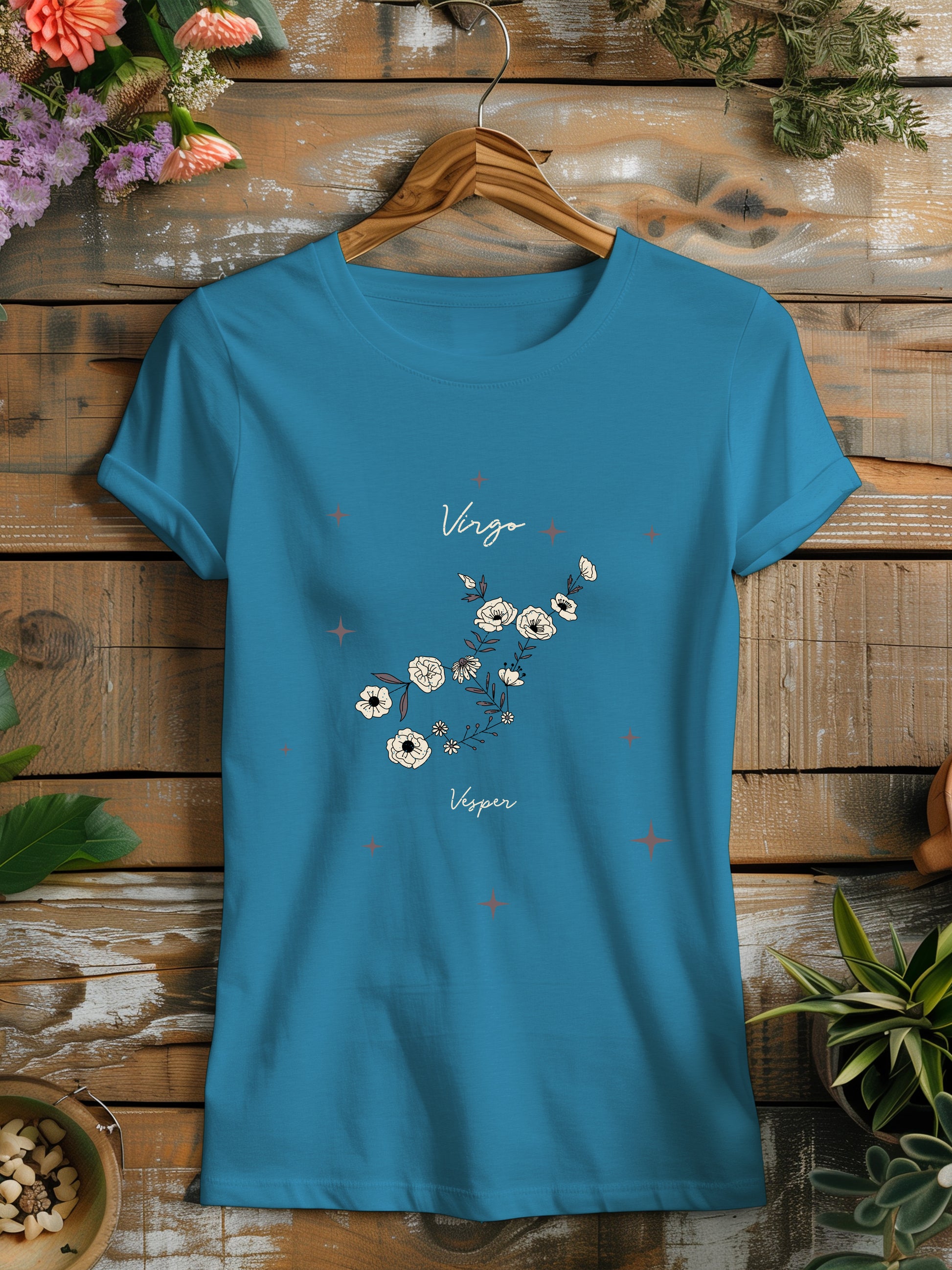 a blue t - shirt with a picture of flowers on it