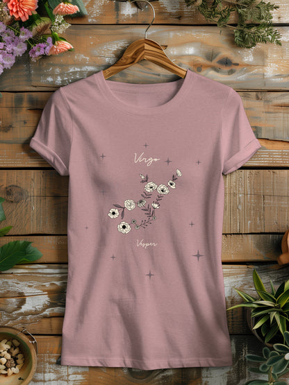 a pink t - shirt with a floral design on it