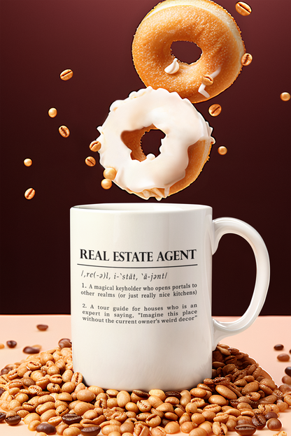 A classic white ceramic mug features a playful definition of 'Real Estate Agent' printed in elegant black font. The text humorously describes the agent as a keyholder to realms and an expert in home decor imagination. 