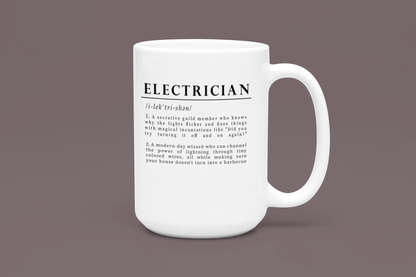 The image shows a white ceramic mug with a humorous definition of 'Electrician' in bold black font. The text describes an electrician as both a secretive guild member and a modern-day wizard of electricity, adding a playful twist to the profession. 