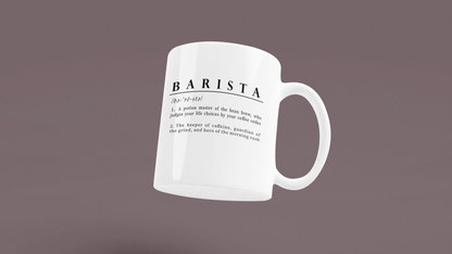 A white coffee cup with a whimsical description of a Barista as a potion master and guardian of the grind